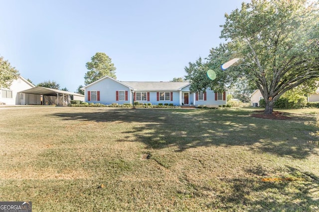 ranch-style home with a carport and a front lawn