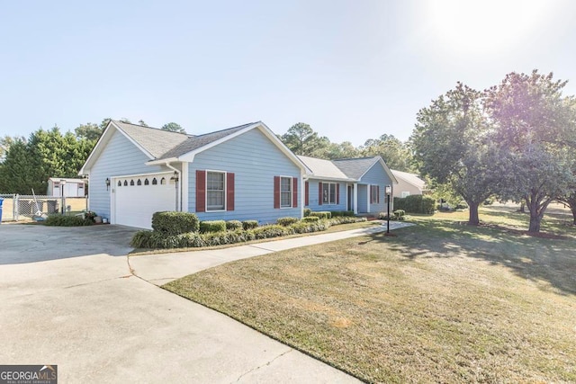 single story home with a garage and a front lawn