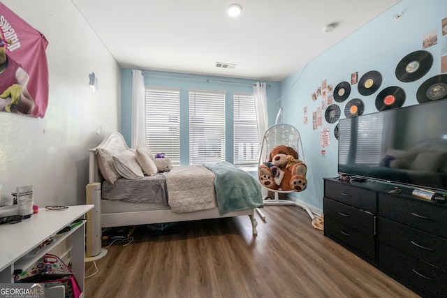 bedroom featuring hardwood / wood-style flooring