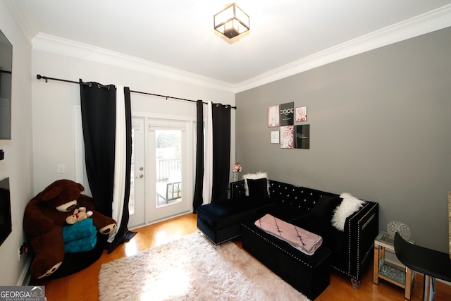 living room with ornamental molding and hardwood / wood-style floors