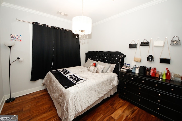 bedroom with ornamental molding and dark hardwood / wood-style floors