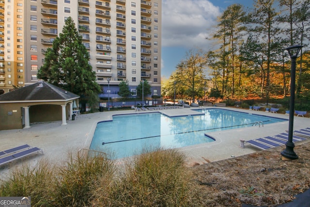 view of swimming pool featuring a patio