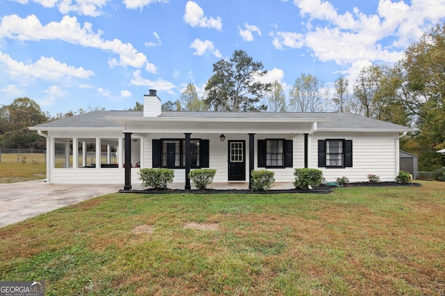 single story home with a porch and a front yard