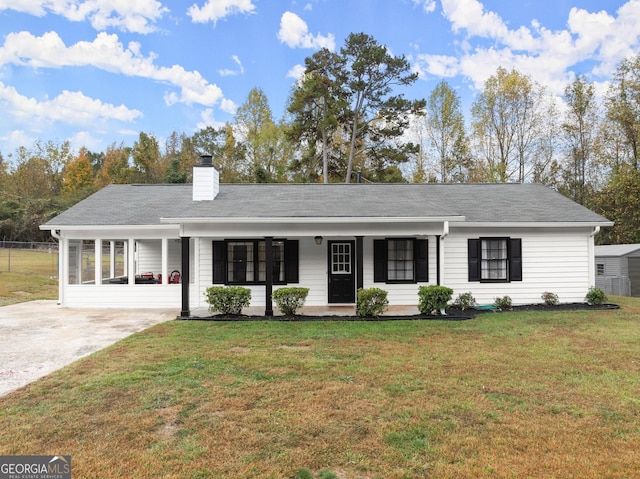 ranch-style home with a porch and a front yard