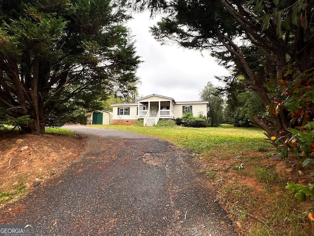 view of front of property with a storage unit