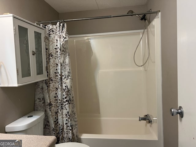 bathroom with shower / bath combo and toilet