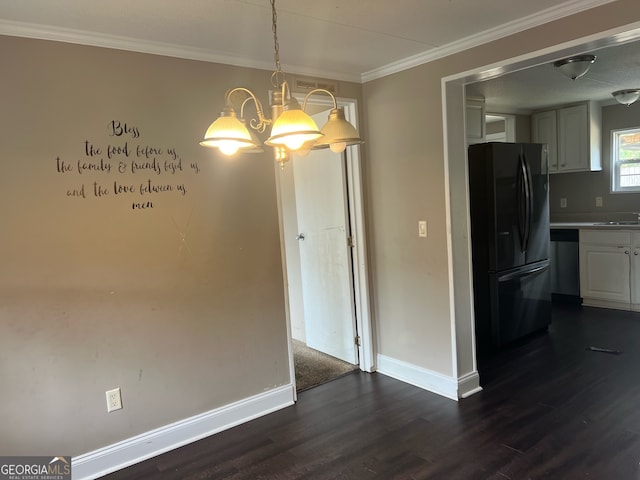 unfurnished dining area featuring dark wood-type flooring, sink, and crown molding