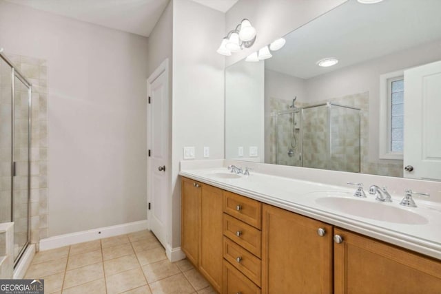 bathroom featuring vanity, tile patterned floors, and a shower with door