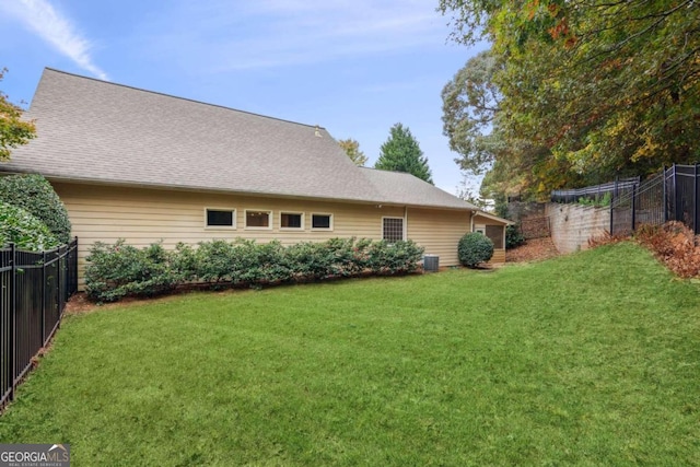 back of house with a yard and cooling unit