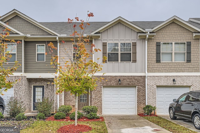 multi unit property featuring a garage