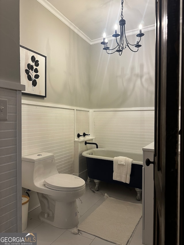 bathroom with a chandelier, a tub to relax in, tile walls, and crown molding