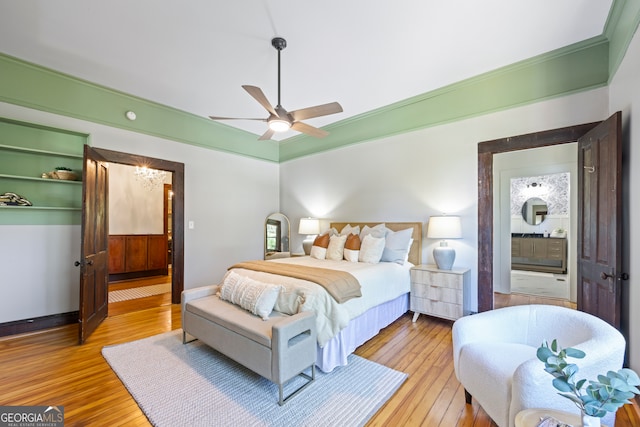 bedroom featuring light wood-type flooring, ceiling fan, and ornamental molding