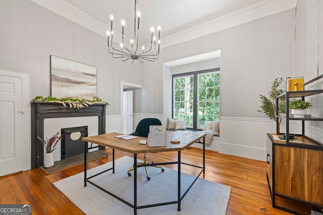 office area featuring ornamental molding, a high ceiling, and hardwood / wood-style flooring