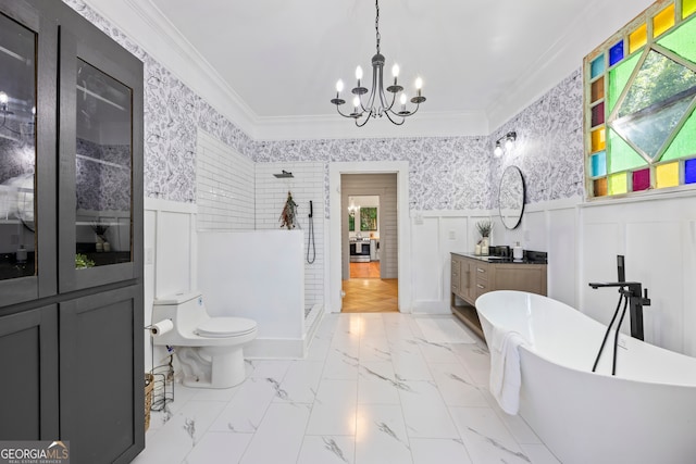 bathroom featuring a washtub, crown molding, vanity, and an inviting chandelier