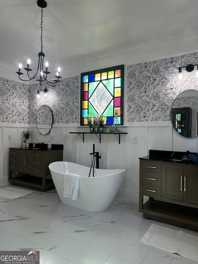 bathroom featuring ornamental molding, vanity, an inviting chandelier, and a bathing tub