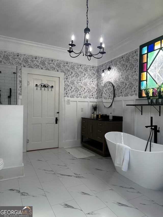 bathroom with a washtub, crown molding, and vanity