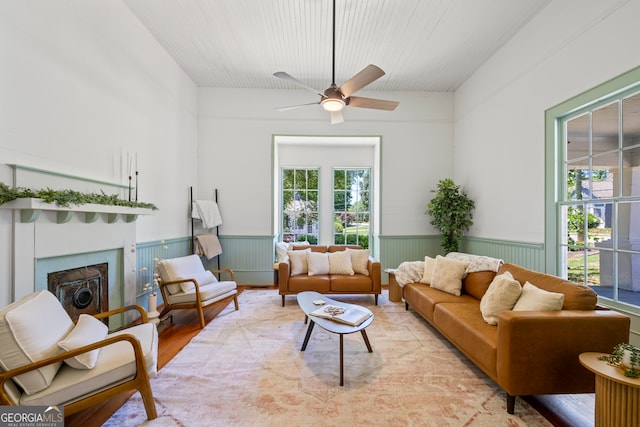 living room featuring light hardwood / wood-style floors and ceiling fan