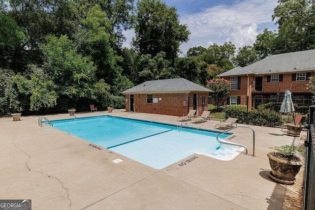 view of swimming pool with a patio