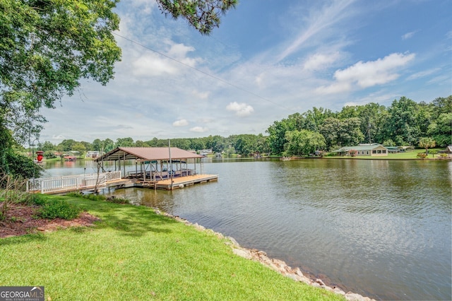 dock area featuring a yard and a water view