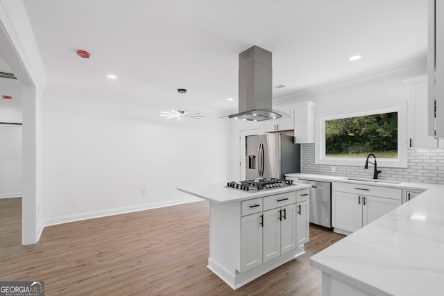 kitchen featuring white cabinetry, stainless steel appliances, a center island, and island exhaust hood