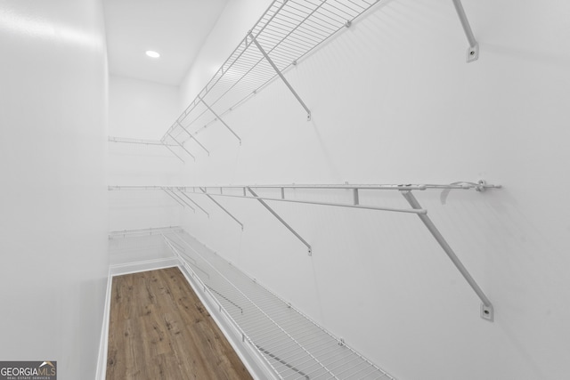 walk in closet featuring hardwood / wood-style floors