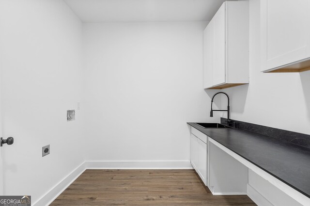 clothes washing area with hookup for an electric dryer, dark wood-type flooring, cabinets, sink, and hookup for a washing machine