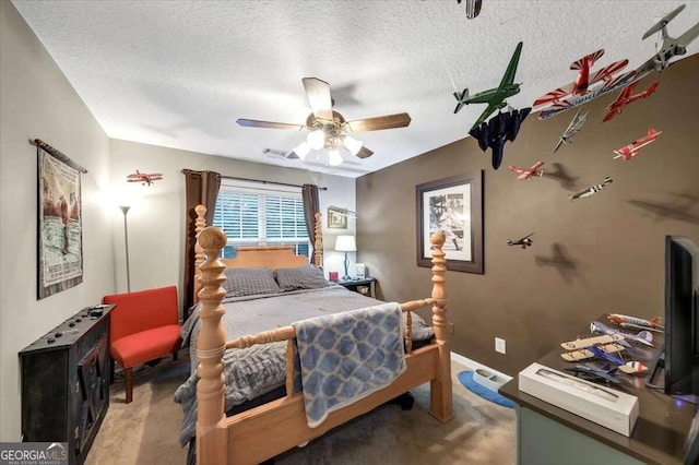 carpeted bedroom with a textured ceiling and ceiling fan