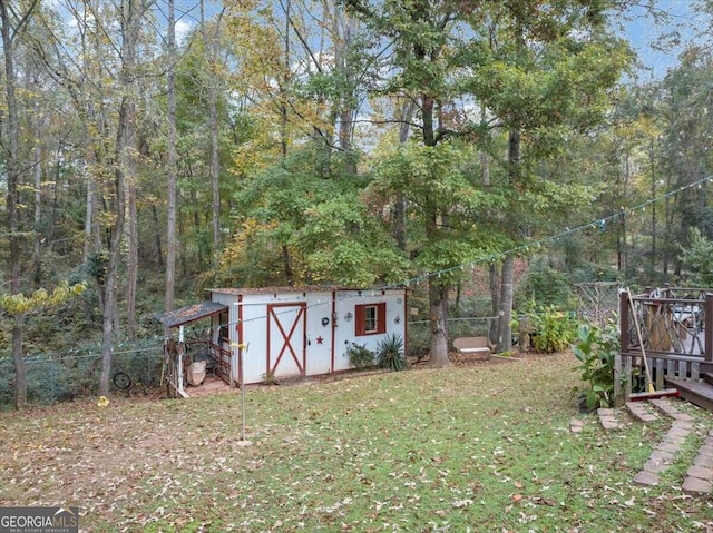 view of outbuilding featuring a lawn