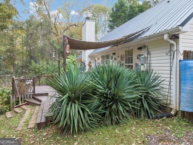 view of side of property with a wooden deck