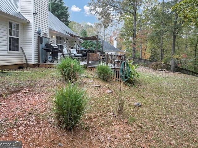 view of yard with a wooden deck