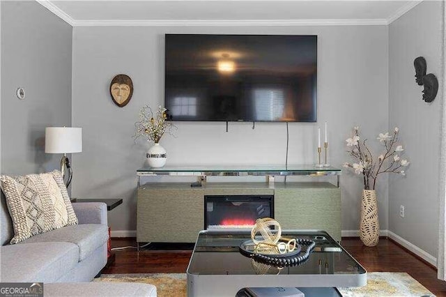 living room with dark hardwood / wood-style flooring and ornamental molding