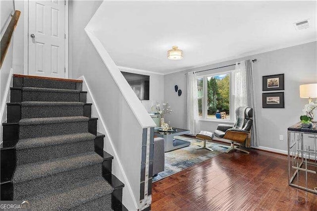 staircase featuring hardwood / wood-style flooring