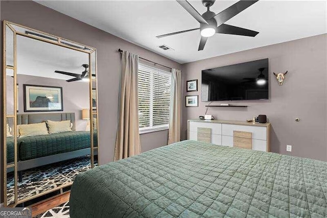 bedroom featuring hardwood / wood-style floors and ceiling fan