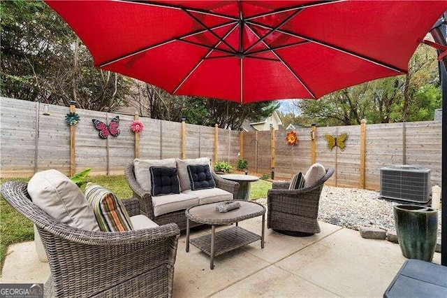 view of patio featuring central air condition unit and an outdoor living space