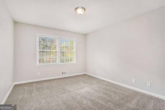 empty room with carpet flooring