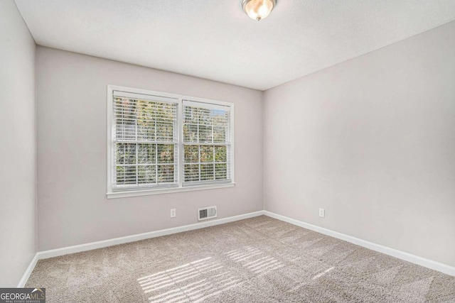 empty room with carpet flooring