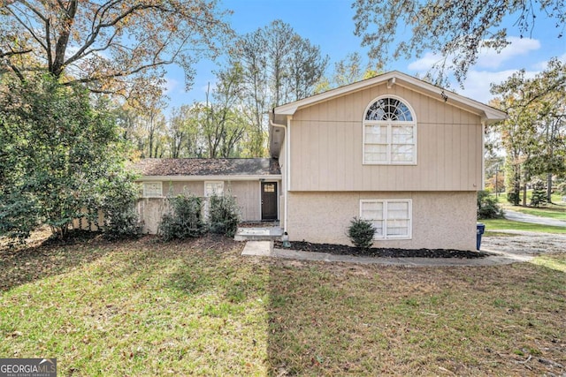 split level home with a front yard