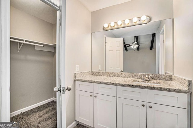 bathroom featuring vanity and ceiling fan