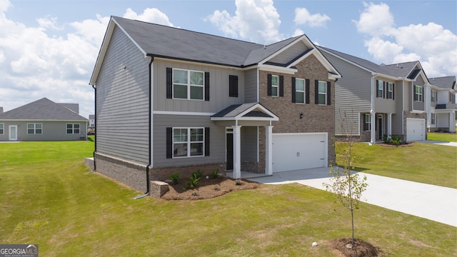 view of front of home with a garage and a front yard