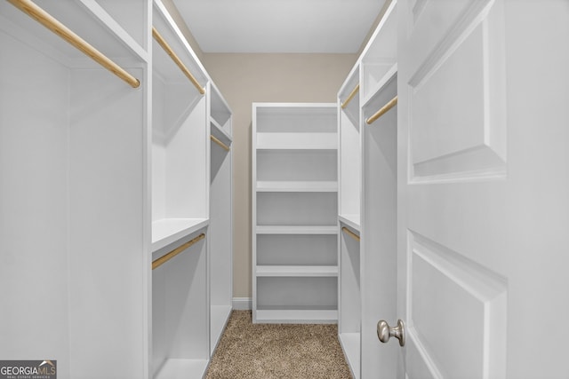 spare room with carpet flooring, lofted ceiling, and ceiling fan