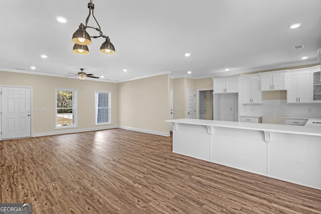 kitchen with white cabinetry, sink, a textured ceiling, dark hardwood / wood-style flooring, and decorative backsplash