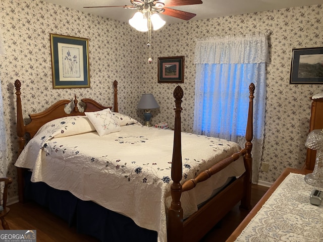 bedroom featuring dark wood-type flooring and ceiling fan