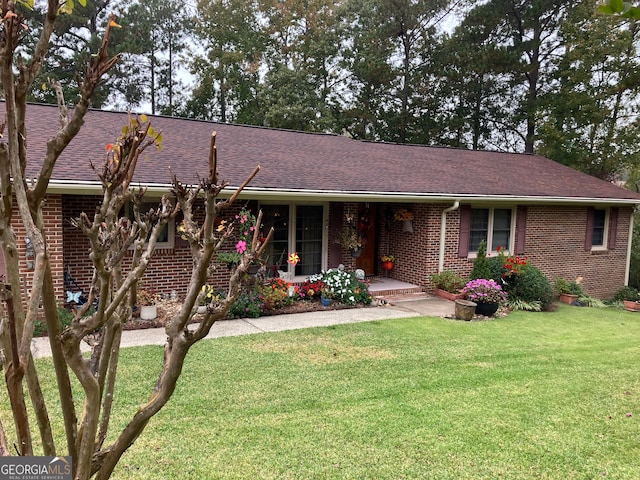 ranch-style house with a front lawn