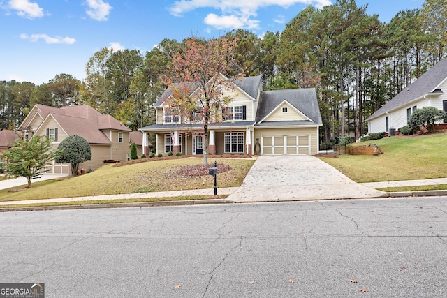 front facade featuring a garage and a front yard