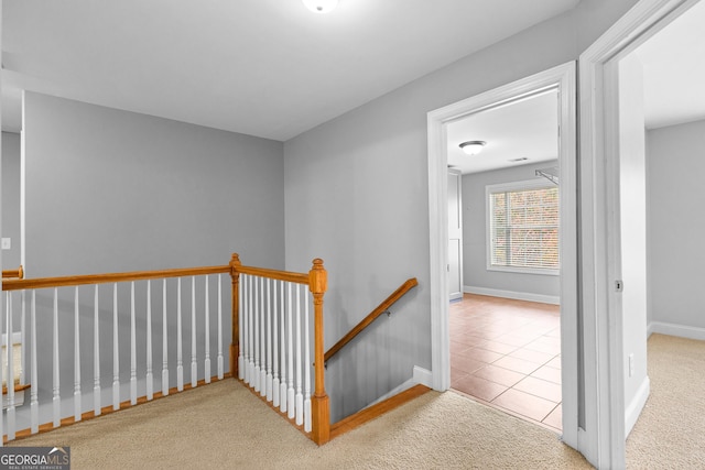 hallway with light carpet