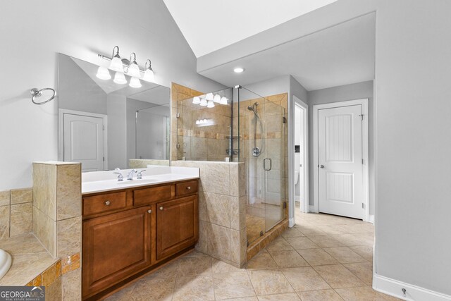 bathroom featuring tile patterned flooring, vanity, plus walk in shower, and lofted ceiling