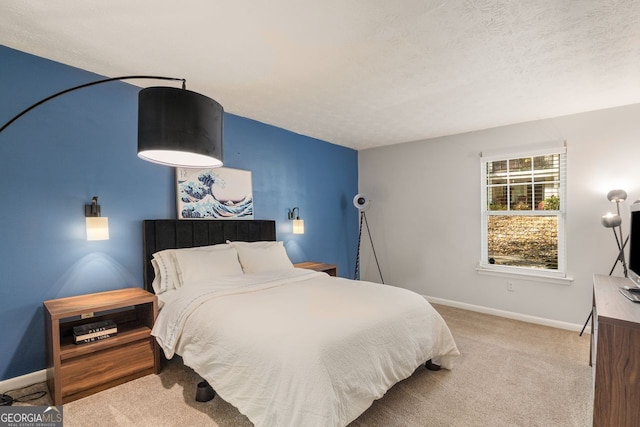 carpeted bedroom featuring a textured ceiling