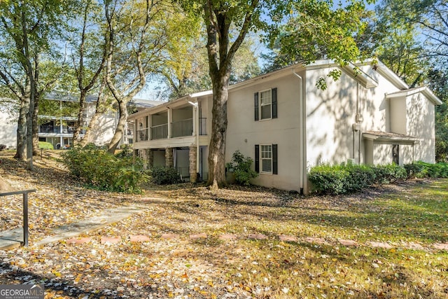 view of front of house with a sunroom