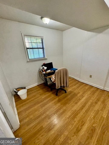 unfurnished room with light wood-type flooring