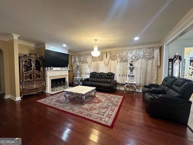 living room featuring dark hardwood / wood-style flooring and ornamental molding